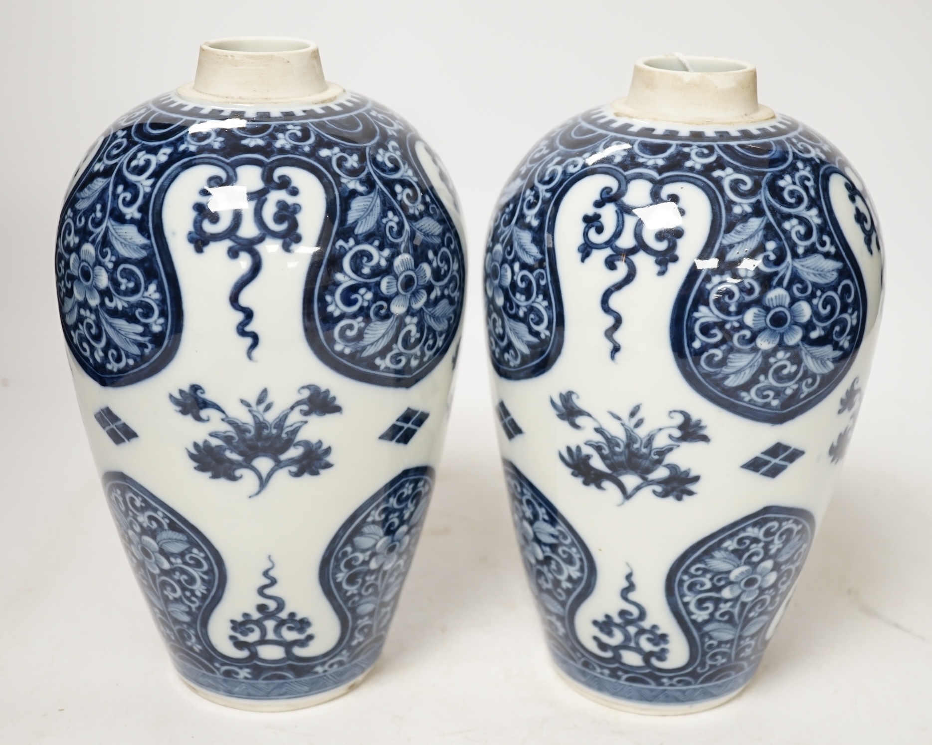 A pair of Samson of Paris blue and white vases, in Kangxi style 23cm high. Condition - good